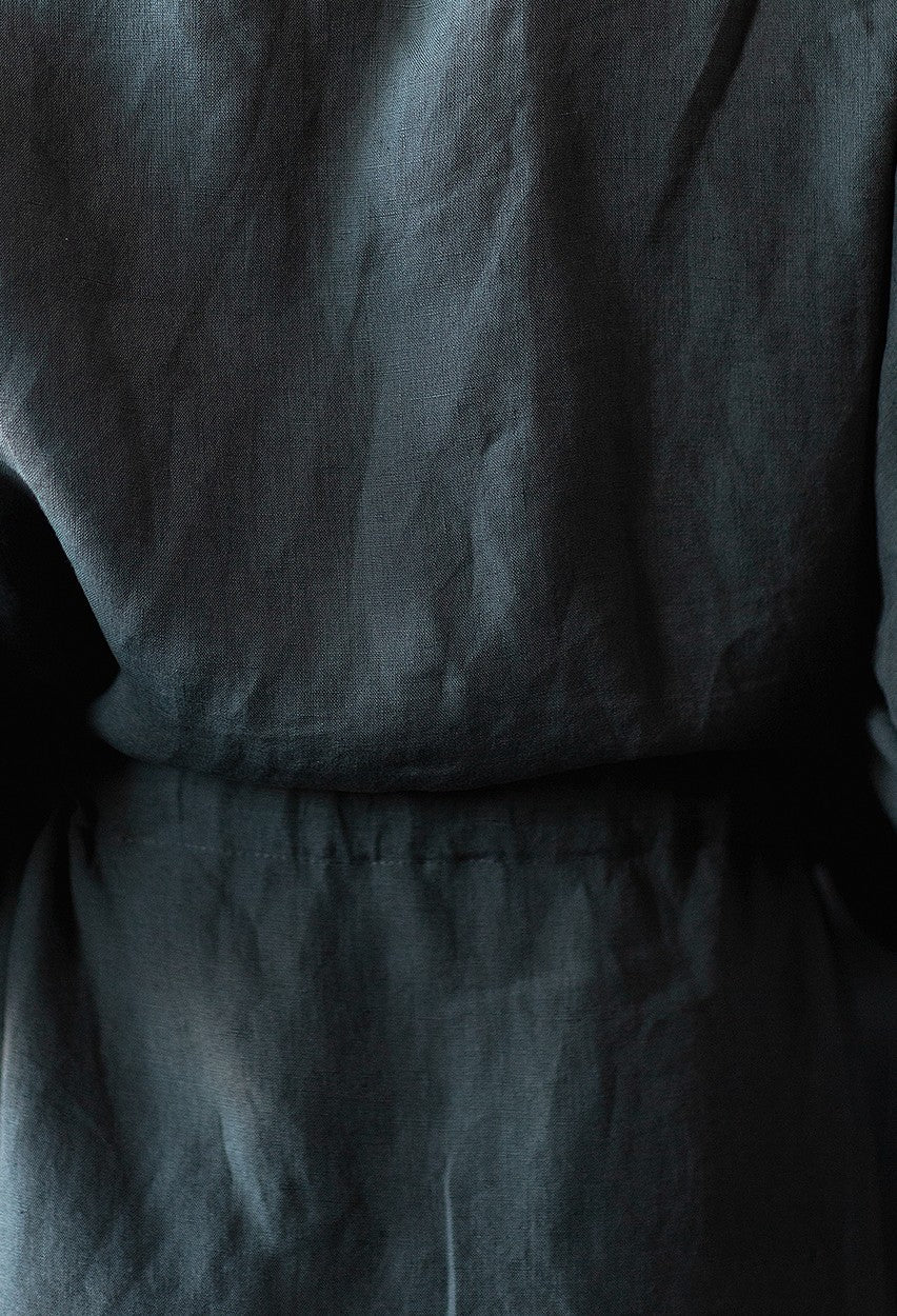 Close-up of grey linen fabric texture from the Passionate linen robe