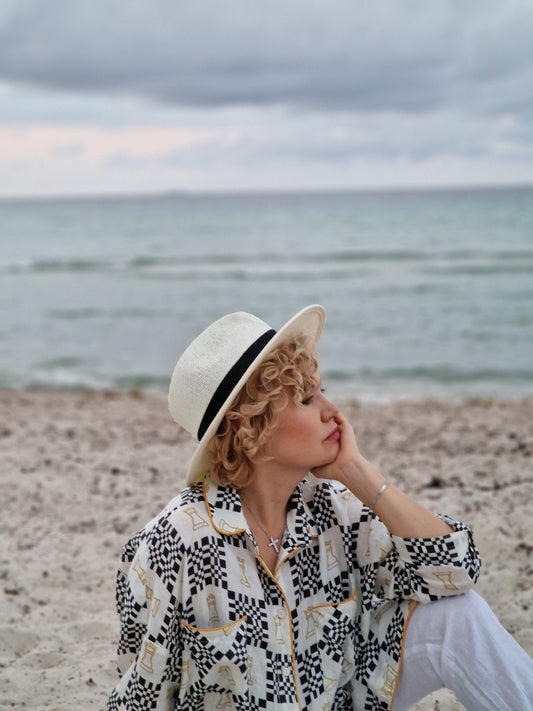 Natalija from Ukraine wearing the Lithuanian-made Grand Duchess Iconic linen dress, inspiring women to achieve success at any age with elegance, confidence, and comfort.