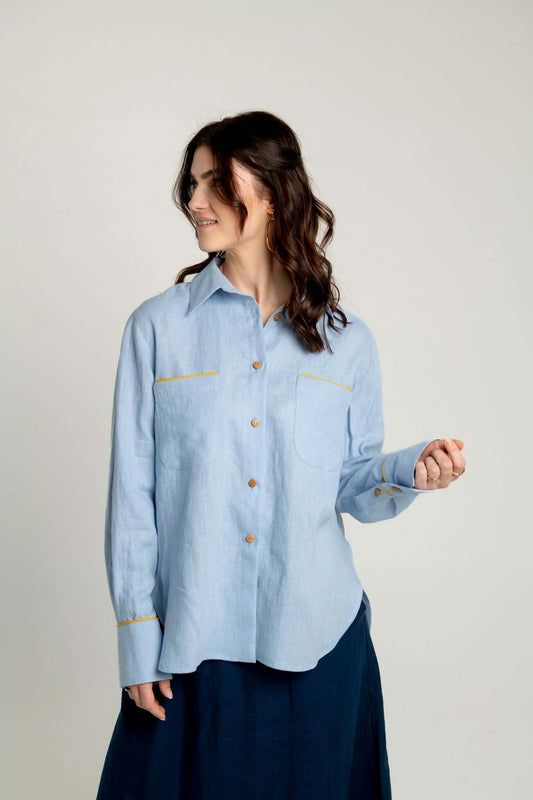 Light blue oversized linen shirt with yellow accents Brillante on a plain background