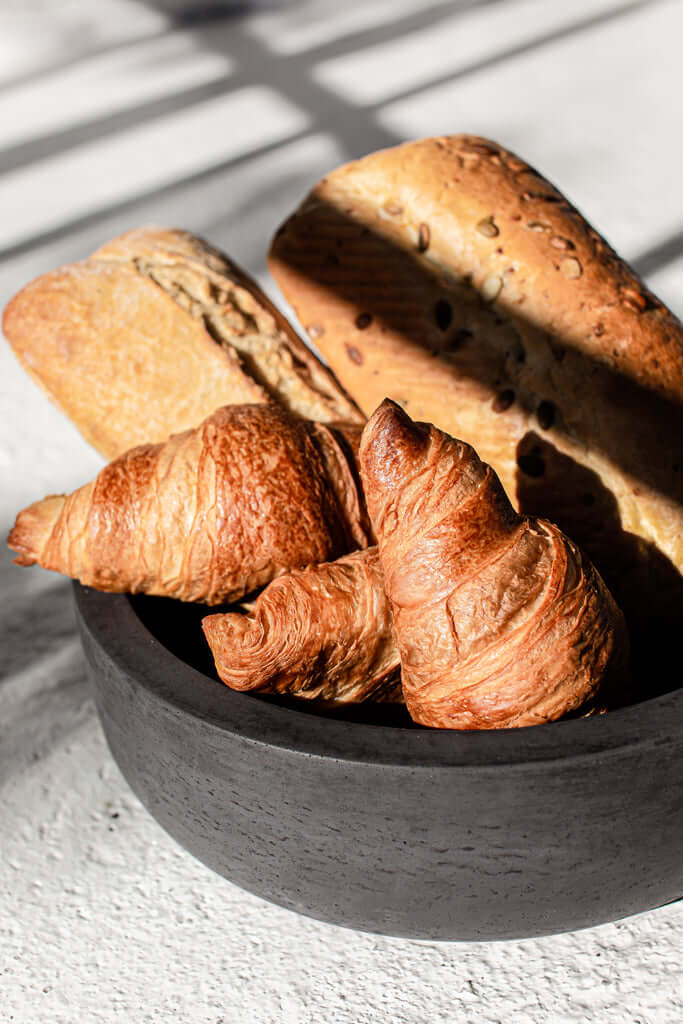Minimalist concrete bowl in black, handmade in Lithuania, ideal for kitchen and dining use