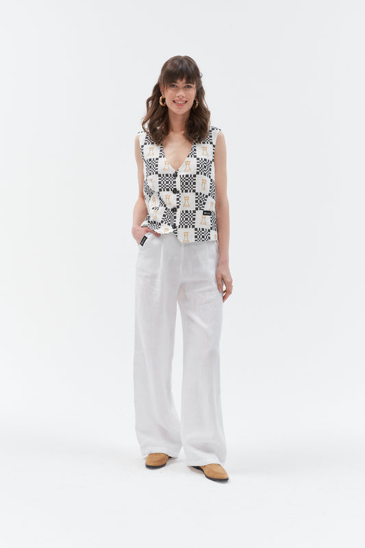 White high-waist wide-leg linen pants with elasticated waistband and side pockets