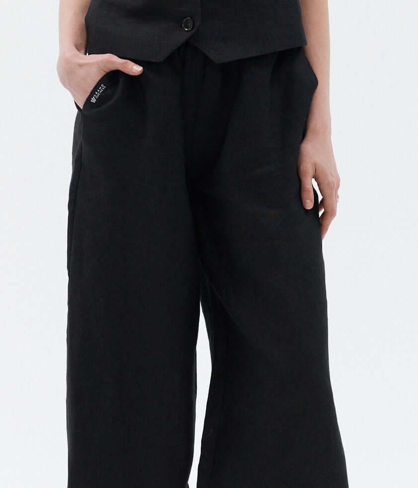 Women’s black wide-leg linen pants Independence II, high-waisted sustainable trousers for versatile style.