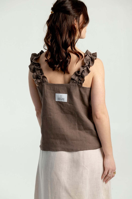 Adventurer II - women’s ruffled strap linen top in brown, showcasing ruffled straps and relaxed fit design.